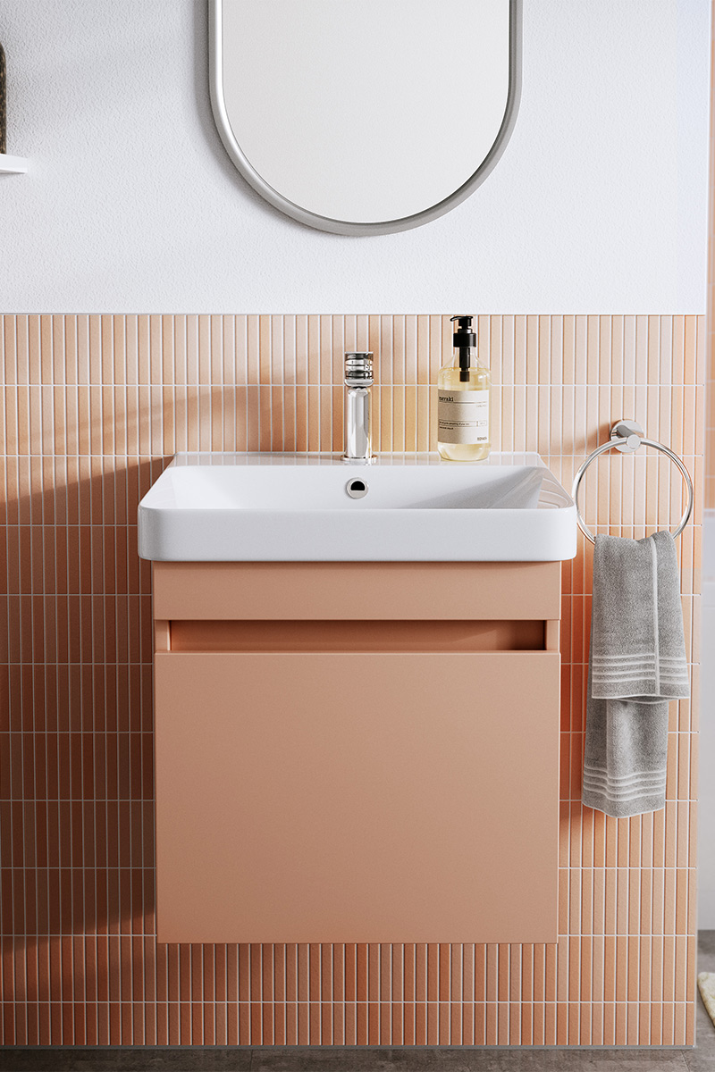 Peach vanity unit with matching tiles 
