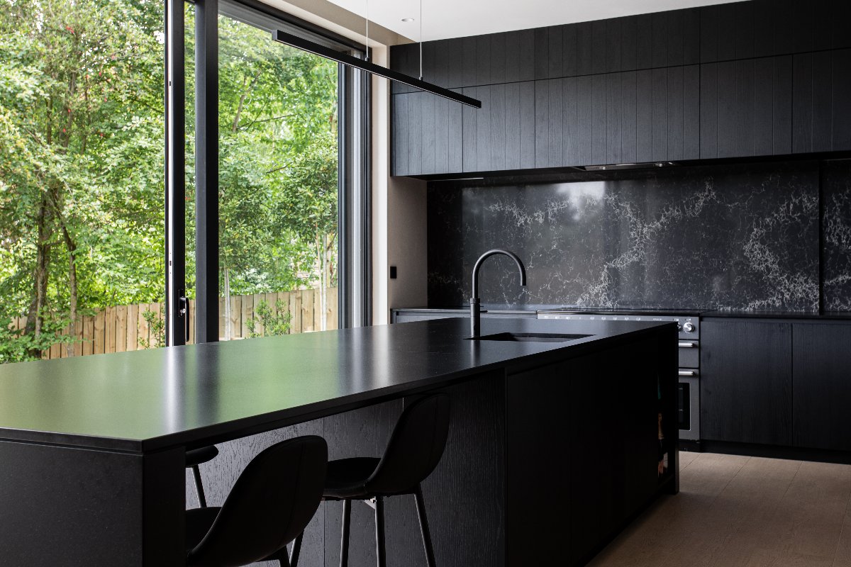 dark kitchen design with statement surface