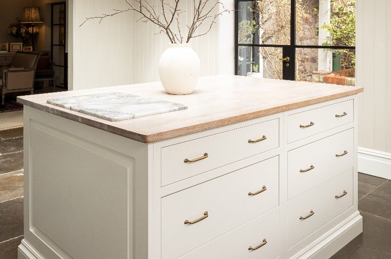 white kitchen island with drawers