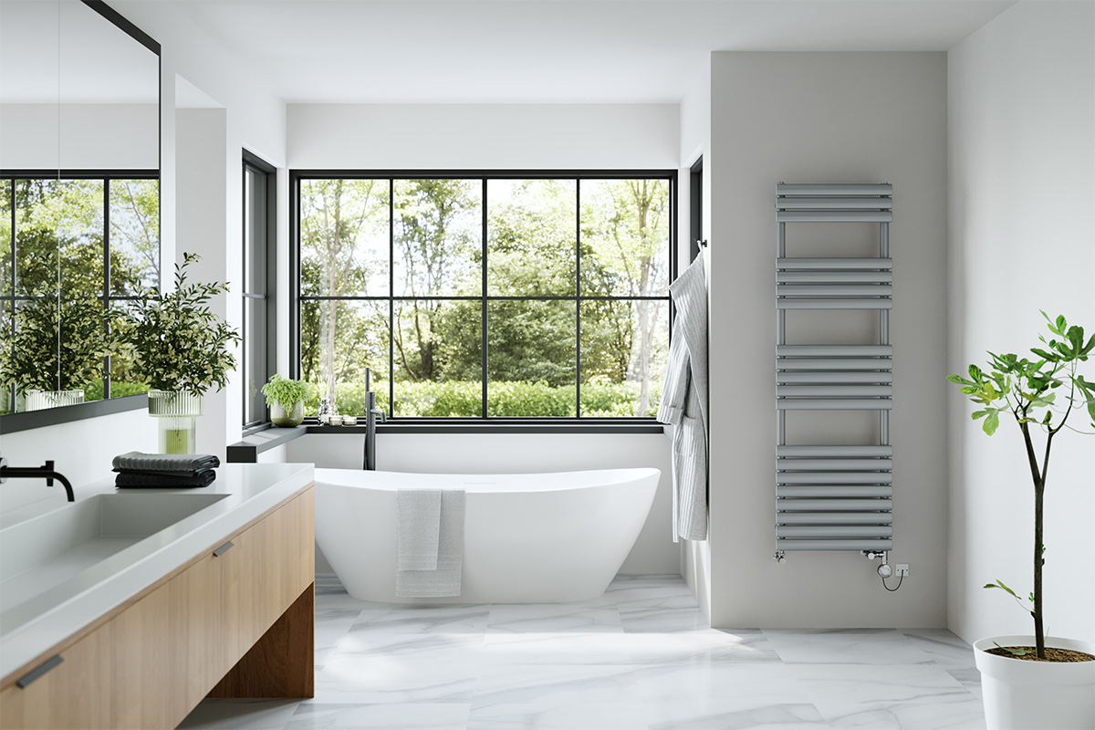 Large bahroom with freestanding bath and towel rail 