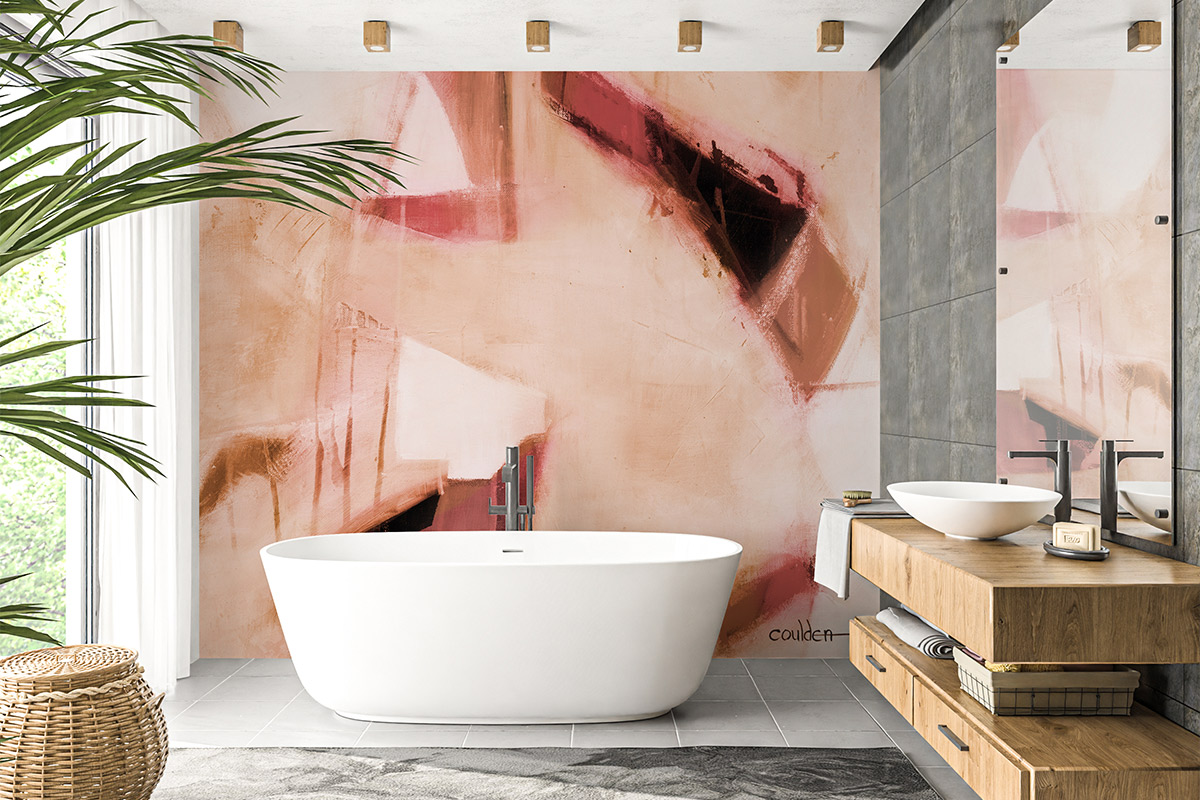 Pink and peach mural behind a white bath 