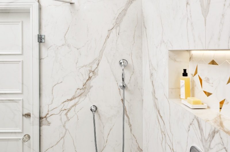 walk-in shower with bookmatched marble